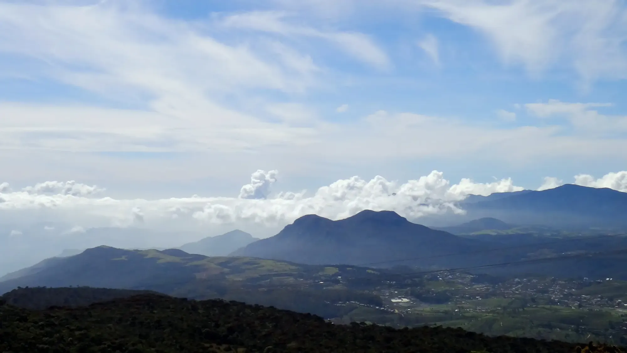 View from Piduruthalaga summit : Standing at 2,524m on the roof of the island, where the high-altitude scrub forest meets the clouds.