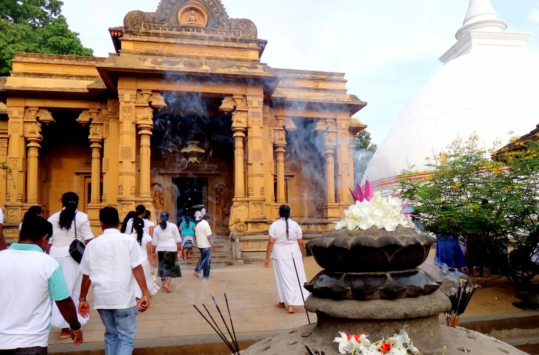 The scent of woodsmoke and jasmine as devotees cross the threshold of the city’s spiritual anchor.